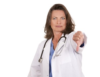 female doctor thumbs down